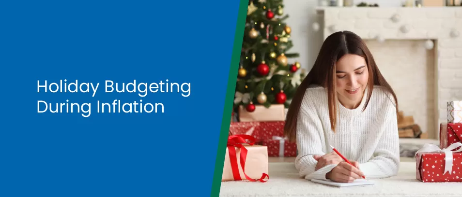 Holiday Budgeting During Inflation - Woman writing a budget with a Christmas tree in the background